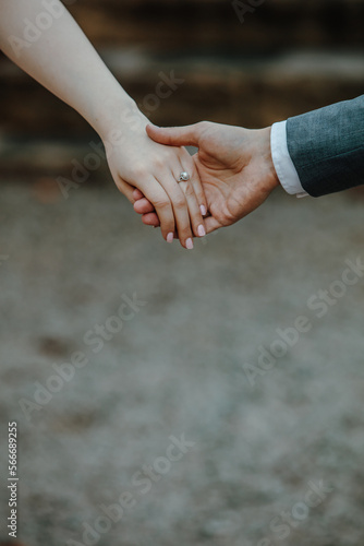 close up of a couple holding hands