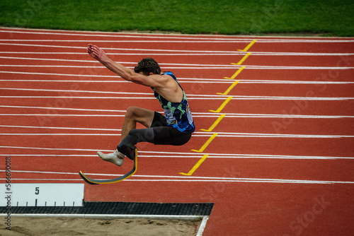 male paraathlete long jump in competition