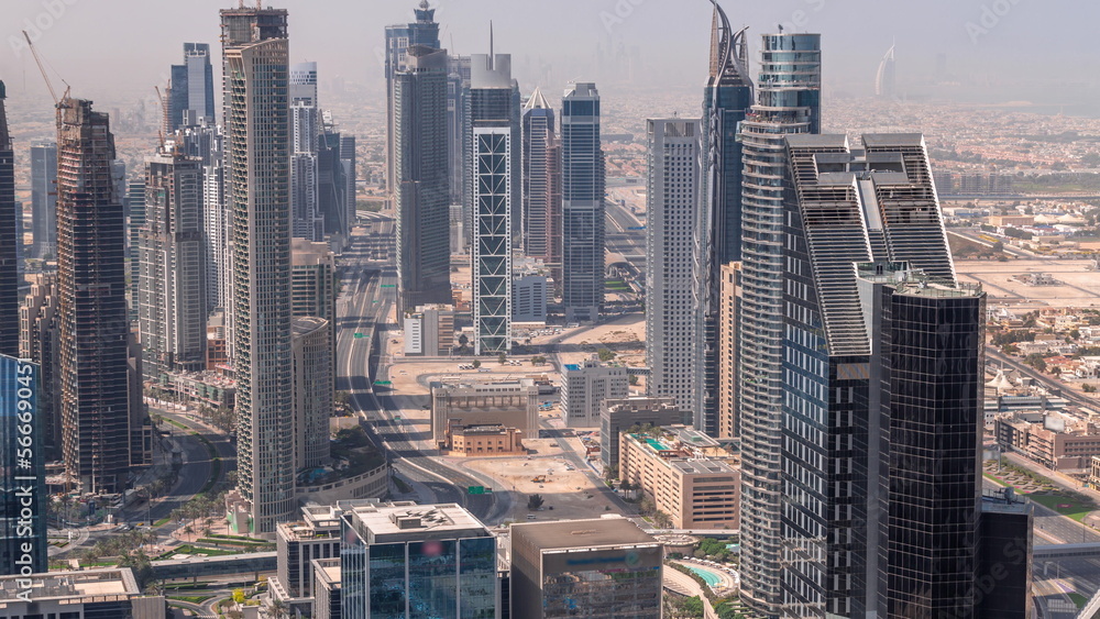 Downtown skyline with modern architecture form above all day . Aerial view of Dubai business bay towers.