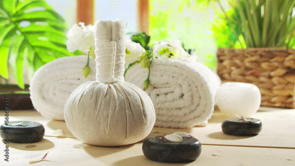 Spa background. Candles, flowers, massaging stones and herbal balls. Massage, oriental therapy, wellbeing and meditation concept. Spa background. Candles, flowers, massaging stones and herbal balls. Massage, oriental therapy, wellbeing and meditation concept.