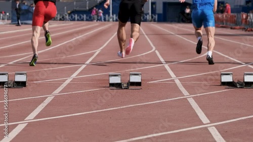 slow motion start male athletes run sprint race photo