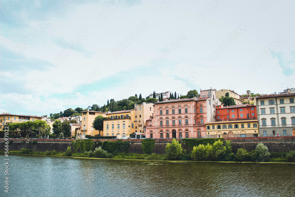 Panoramic view of beautiful Italian houses on the Arno River in Florence, Italy