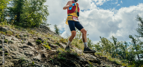 Obraz na plátně athlete runner running race from mountainside