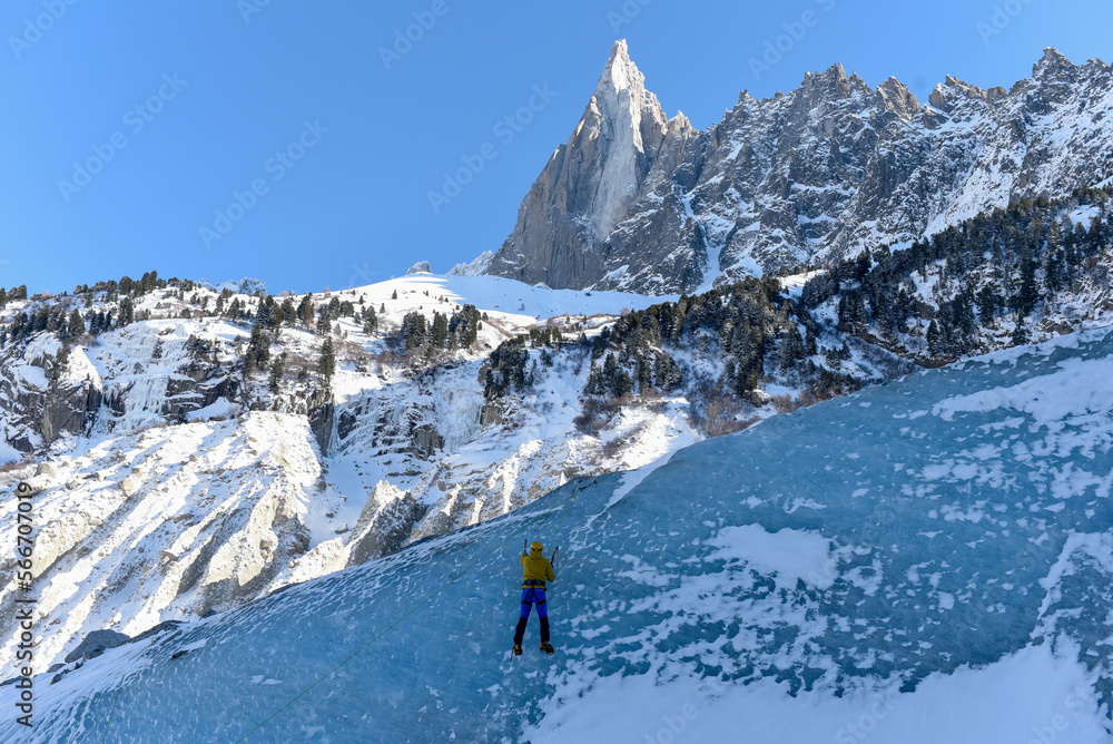 Climber climbs Mer de Glace in Chamonix towards the peak of the mountain