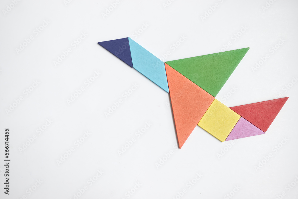 color wood tangram puzzle in airplane shape on white background color wood tangram puzzle in airplane shape on white background