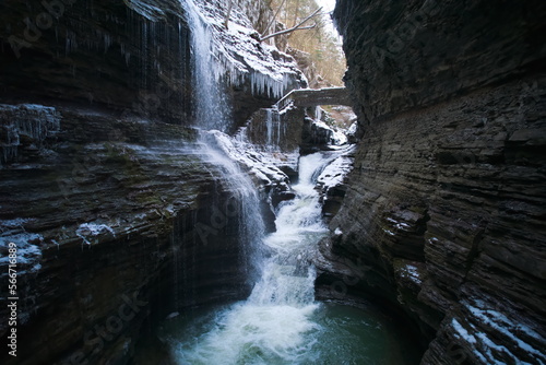a cascade of waterfalls inside a cavern. rainbow falls at watkins glen state park in new york 