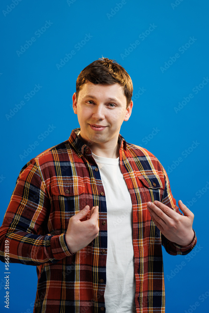 Happy handsome man pointing at himself, smiling pleased, Its me, promoting personal abilities, choose me gesture, standing over blue background and bragging Happy handsome man pointing at himself, smiling pleased, Its me, promoting personal abilities, choose me gesture, standing over blue background and bragging