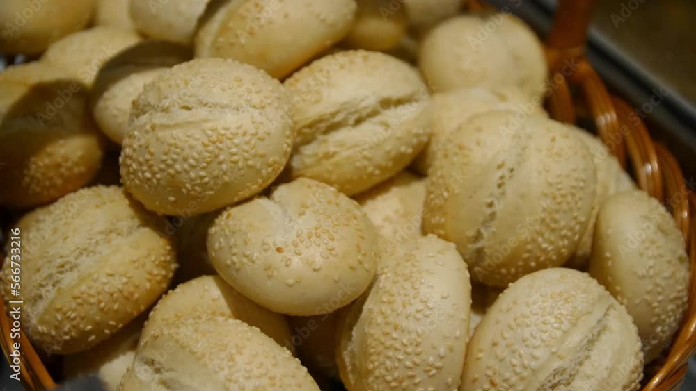Delicious bread with sesame seeds in a basket Delicious bread with sesame seeds in a basket
