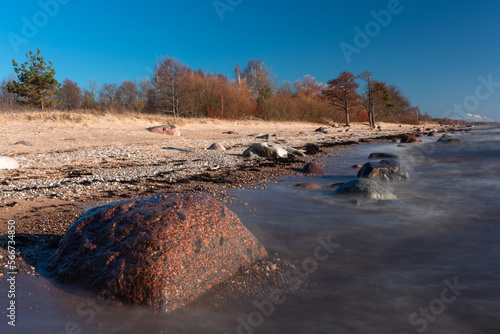 Fototapeta Naklejka Na Ścianę i Meble -  Rocky beach of the Baltic Sea at sunset