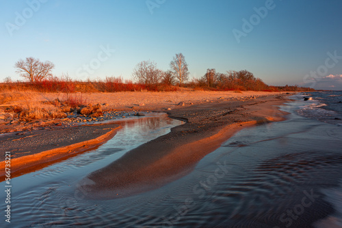 Fototapeta Naklejka Na Ścianę i Meble -  Rocky beach of the Baltic Sea at sunset