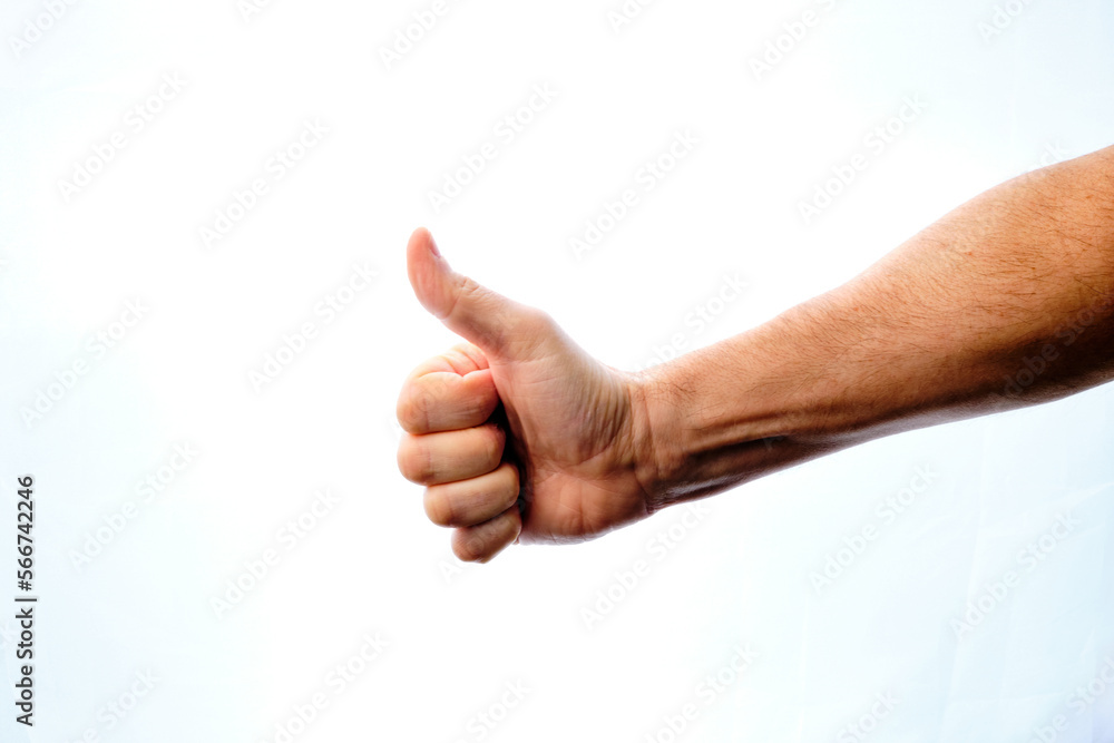 Man's hand with thumbs up giving an ok, ok sign. Man's hand with thumbs up giving an ok, ok sign.