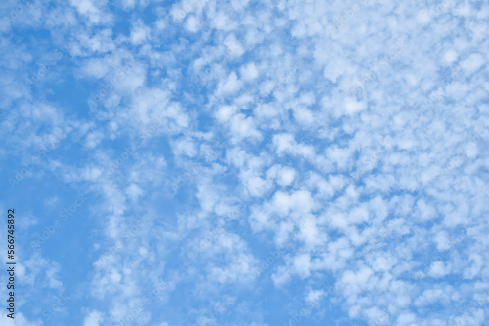 White fluffy patchy clouds on blue sky