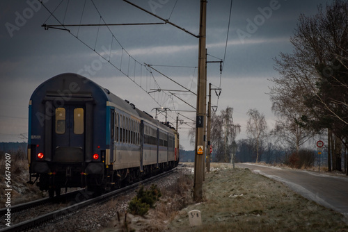 Passenger electric train in frosty cloudy morning near station Donov 01 30 2023