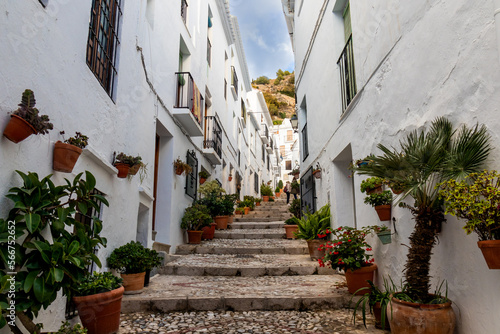 Typical street of Frigiliana, Málaga, one of the most beautiful towns in Spain. With its white walls, its narrow streets and some with a lot of stairs and plants. © Manoli Pérez