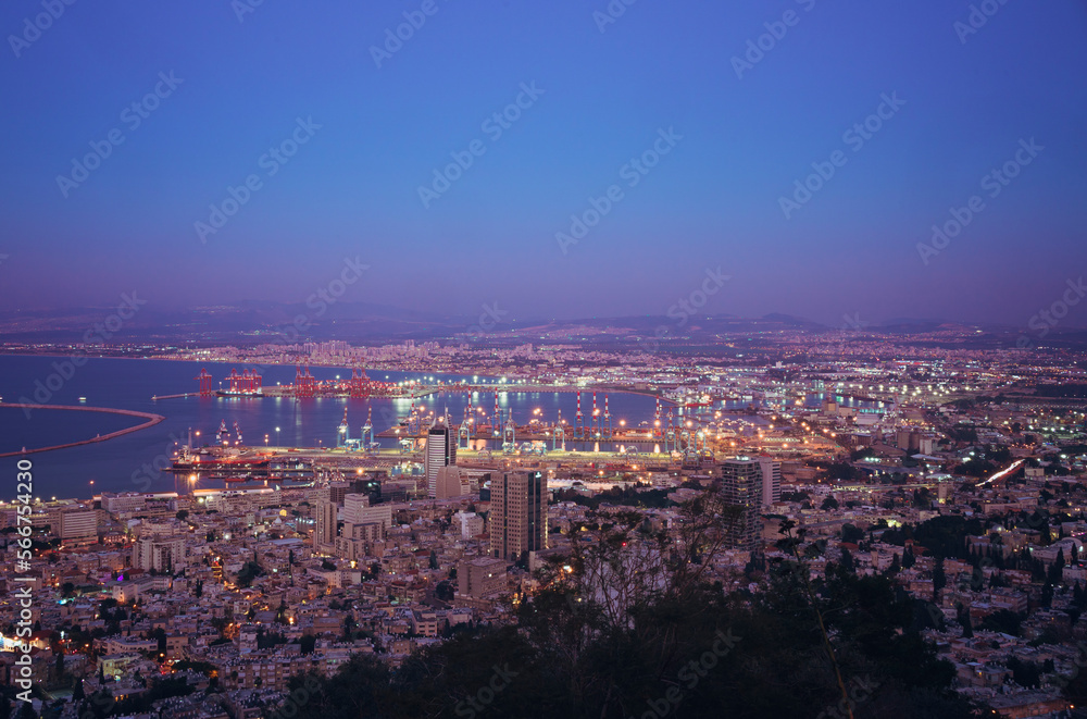 Beautiful panorama of the evening city. Haifa at sunset, view from Mount Carmel (Louis Promenade) long exposure, Israel