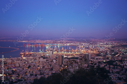 Beautiful panorama of the evening city. Haifa at sunset, view from Mount Carmel (Louis Promenade) long exposure, Israel