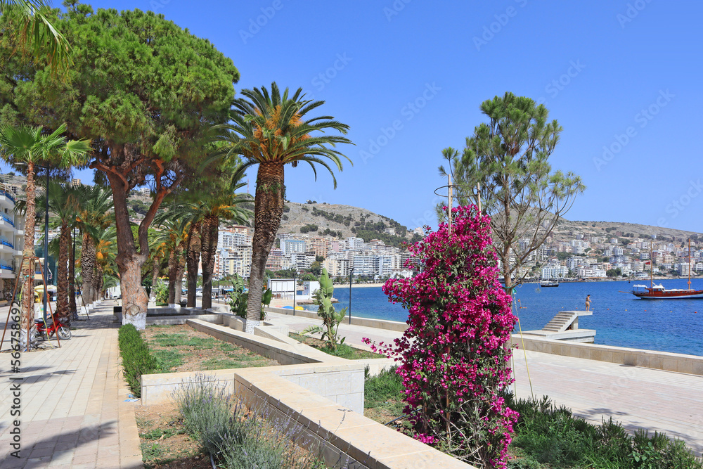 City embankment with modern sculptures in a sunny summer day in Saranda, Albania