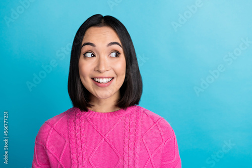 Photo of pretty positive charming japanese woman smile wear pink knitted look empty space enjoy advertisement isolated on blue color background