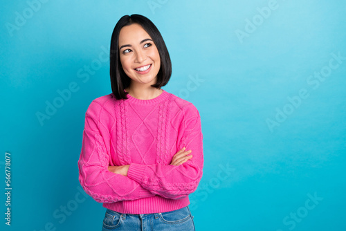 Portrait of pretty positive girl beaming smile folded hands look empty space isolated on blue color background