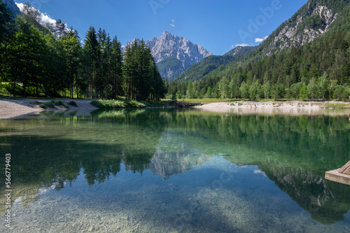 Lake called Jasna in European Slovenian Julian Alps, beautiful water surface with reflections near the road to Vrsic Pass photo