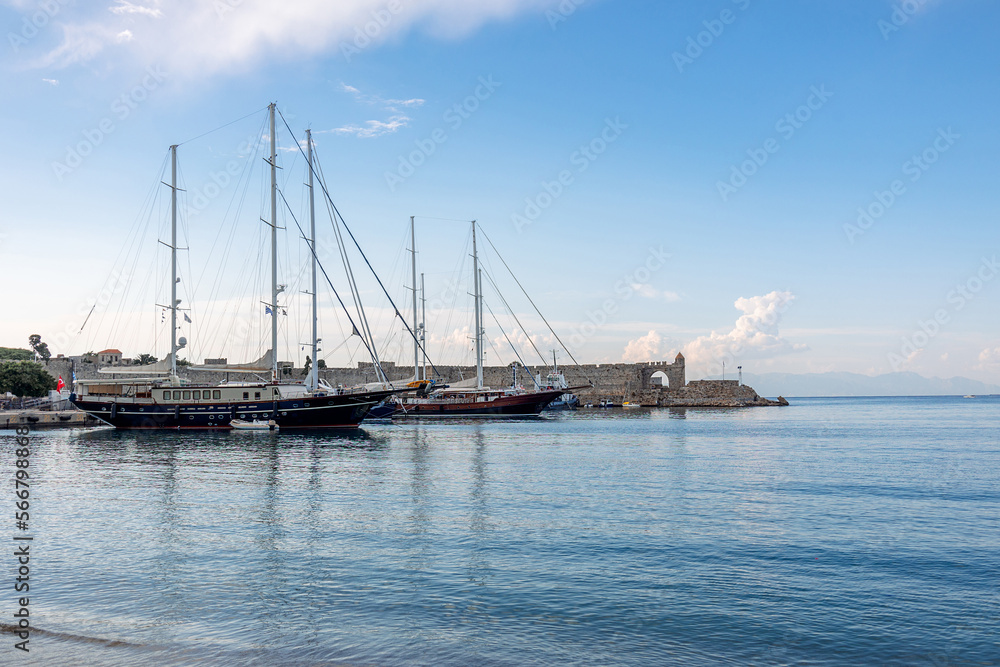 Panoramic view of beautiful yachts stand in harbor in port of Rhodes, Greece. High quality photo