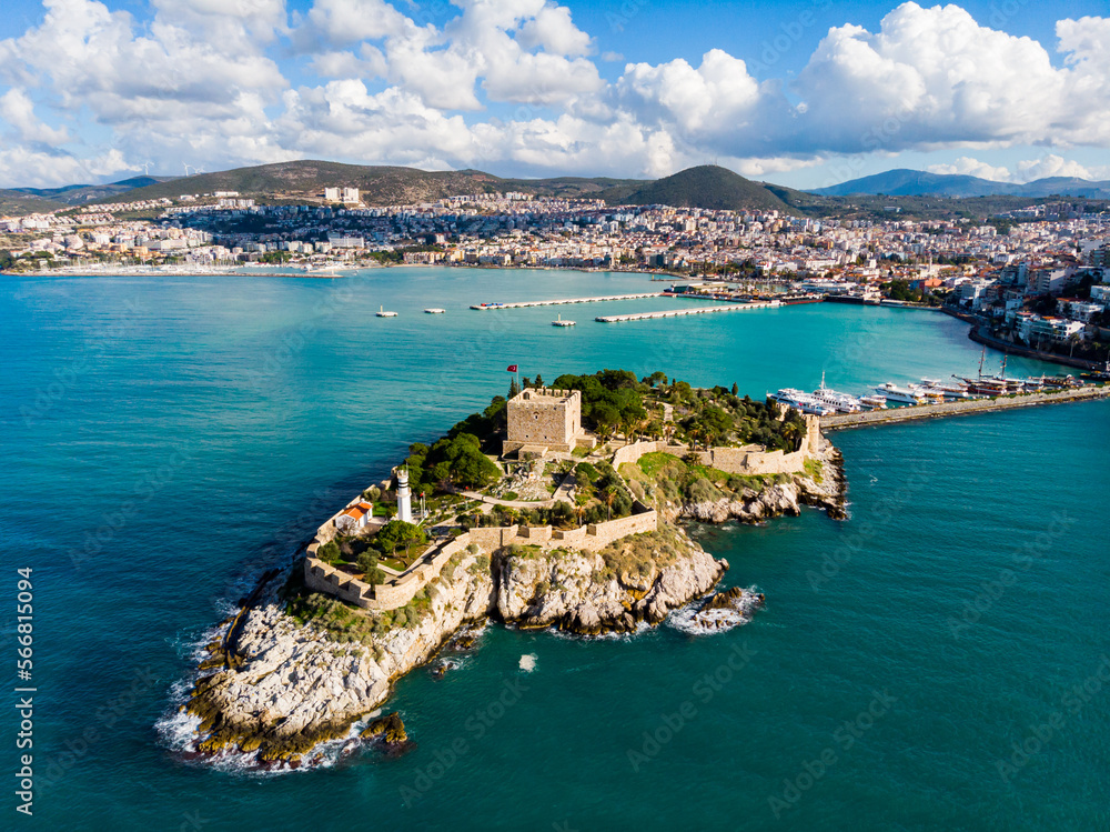 View of Guvercinada or Pigeon Island in the Aegean Sea with the Kusadasi Pirate castle in summer day, Turkey