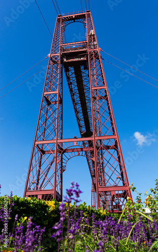 View of metal support tower of Vizcaya ferry Bridge on Nervion river bank in Portugalete, Spain