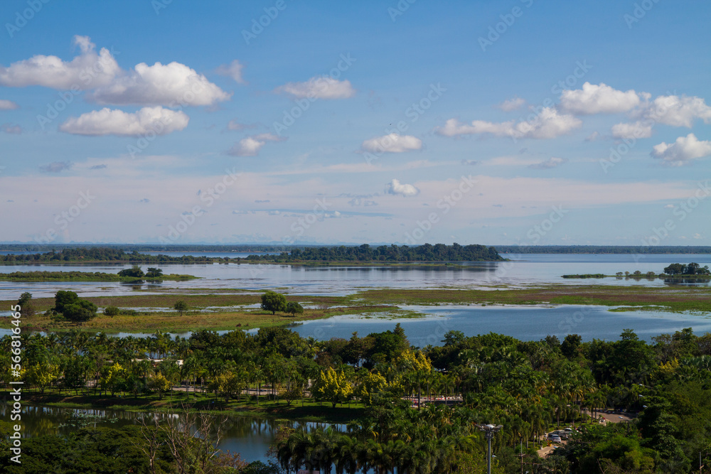 Nong Han Sakon Nakhon View Point High angle. Fresh green trees on the river bank and clear sky.