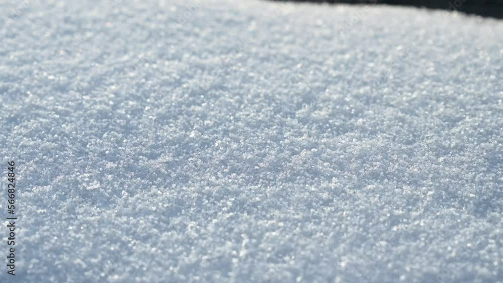 Snow surface on sunny winter day. Close up of fresh white snow texture. Snow surface on sunny winter day. Close up of fresh white snow texture.