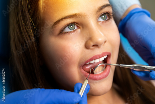Closeup shot of beautiful little girl having dental check up 