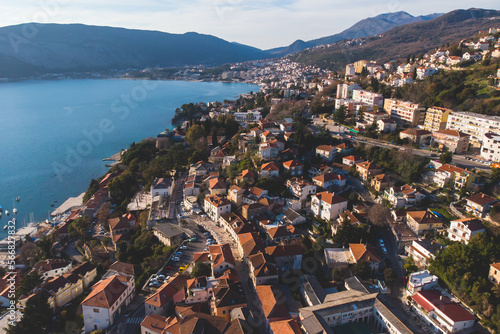 Herceg Novi town and Kotor bay, aerial drone view of Herzeg Novi panorama, Montenegro, with old town scenery, fortress mountains, Mount Orjen Adriatic sea coast in a sunny day photo