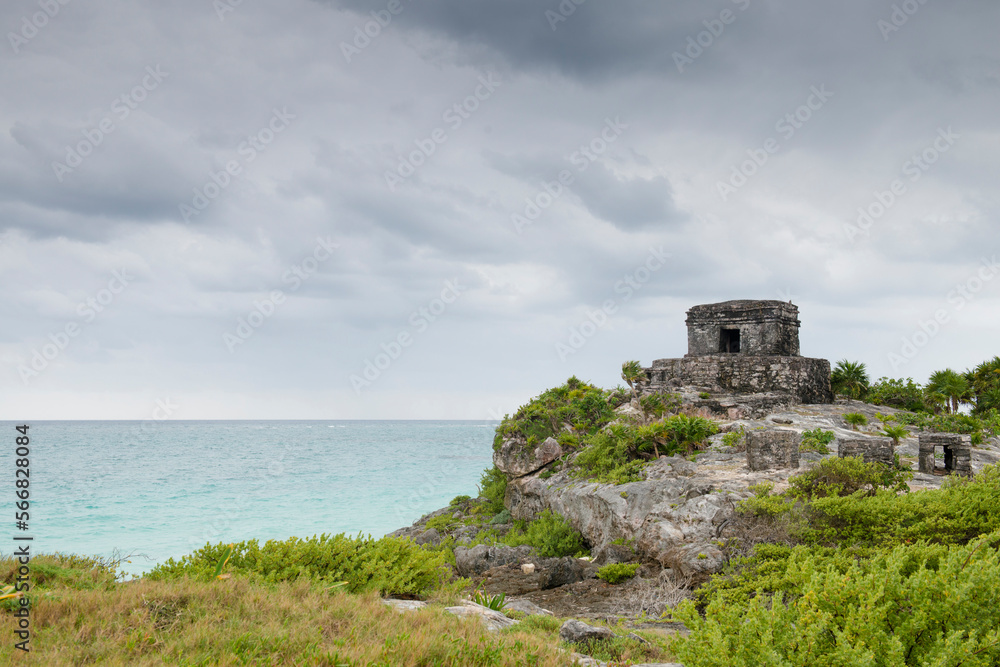 Ruins in front of the ocean on a stormy weather in Tulum, Mexico. Ruins in front of the ocean on a stormy weather in Tulum, Mexico.