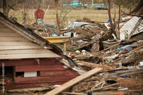 Wreckage from Superstorm Sandy - including cars, roofs, house-walls and personal effects -  litters the streets of Union Beach, NJ photo