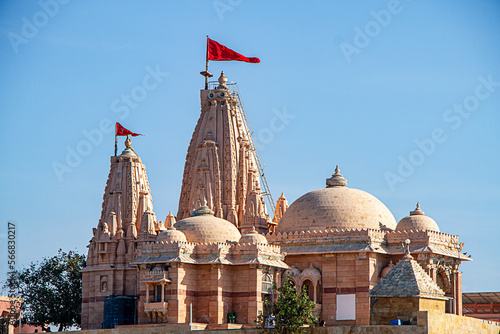 Koteshwar Mahadev Temple with Red pendant flying on top situated in Koteshwar Gujarat at the Kori Creek during low tide