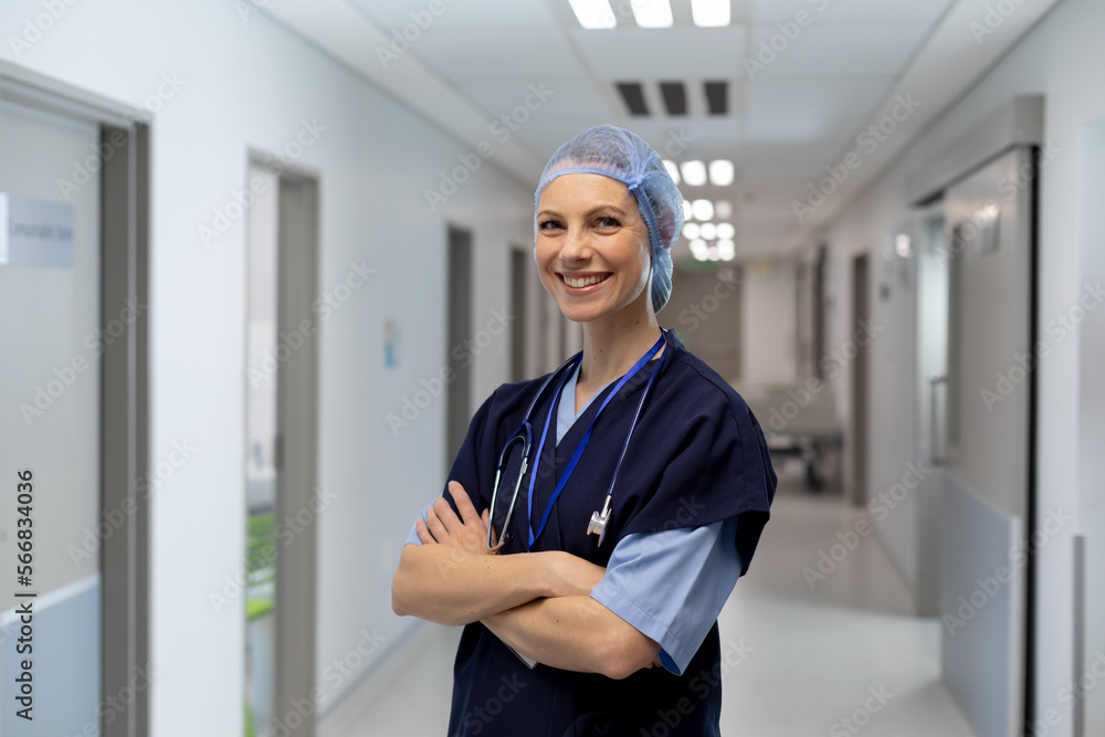 Portrait of happy caucasian female doctor wearing hair net working at hospital Portrait of happy caucasian female doctor wearing hair net working at hospital