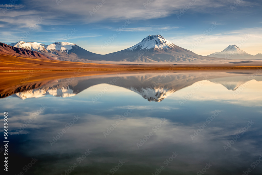 Salt lake Lejia reflection, idyllic volcanic landscape at Sunset, Atacama, Chile