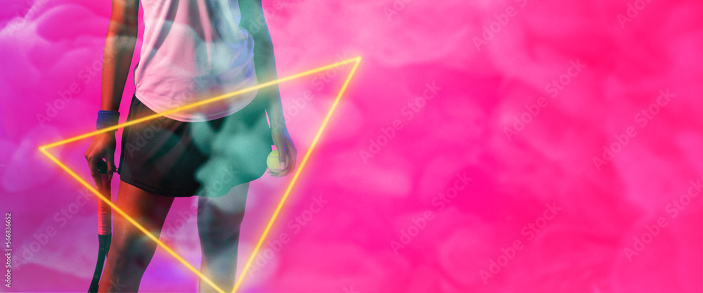 Fototapeta premium Midsection of african american female player with racket and ball by triangle on smoky background