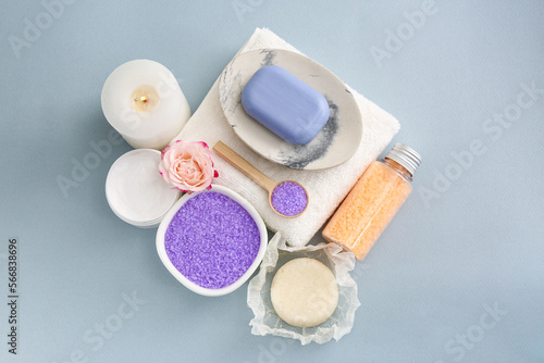 Sea salt, candle and soap bar on light grey background, flat lay © New Africa
