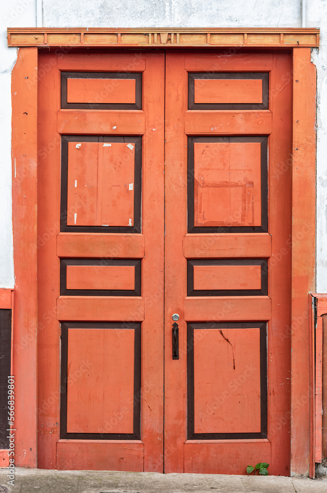 Red wooden door. Old frame texture.