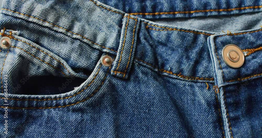 Close up of jeans on grey background with copy space Close up of jeans on grey background with copy space