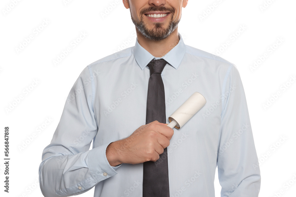 Man cleaning shirt with adhesive lint roller on white background, closeup Man cleaning shirt with adhesive lint roller on white background, closeup