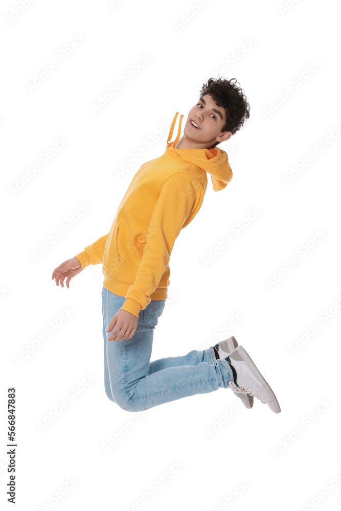 Happy teenage boy jumping on white background Happy teenage boy jumping on white background
