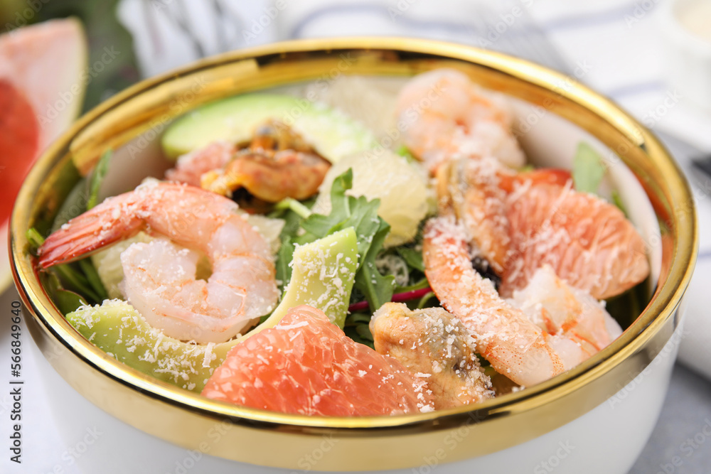 Delicious pomelo salad with shrimps on table, closeup view Delicious pomelo salad with shrimps on table, closeup view