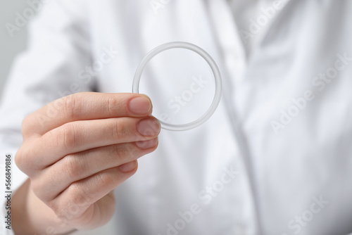 Doctor holding diaphragm vaginal contraceptive ring, closeup