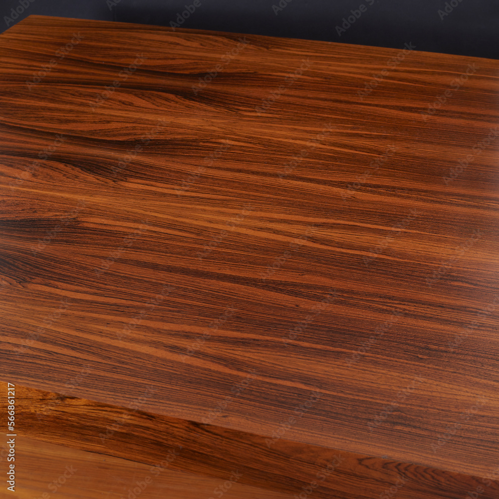Top view of a rosewood dining table. Wood grain texture. Top view of a rosewood dining table. Wood grain texture.