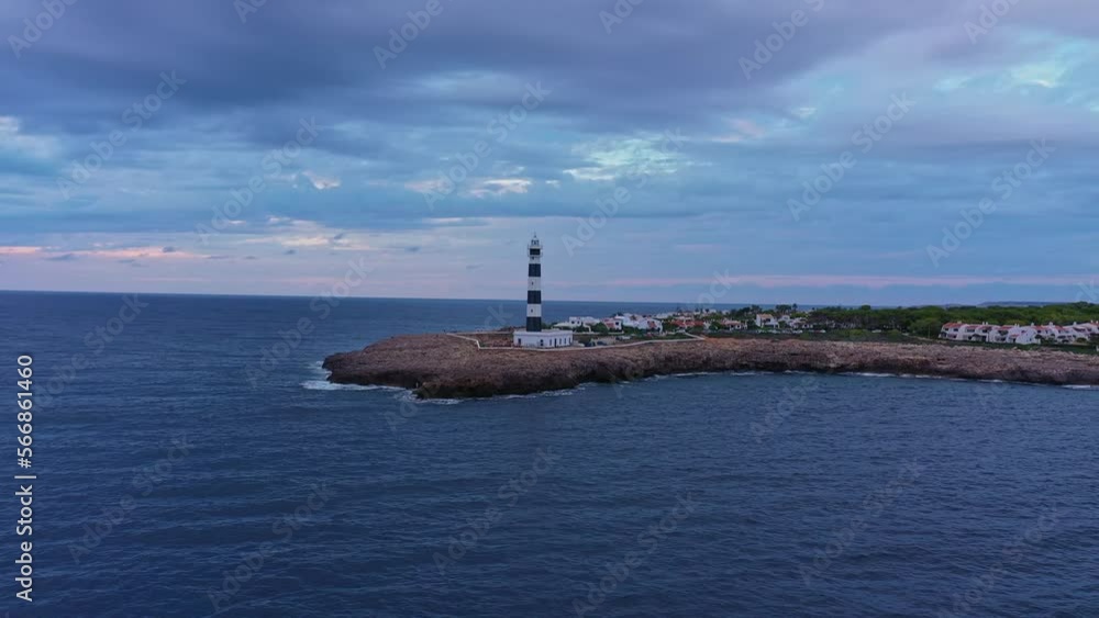 Aerial pull back reveal of Menorca, Spain Artrutx Lighthouse. Cala en Bosch. Aerial pull back reveal of Menorca, Spain Artrutx Lighthouse. Cala en Bosch.