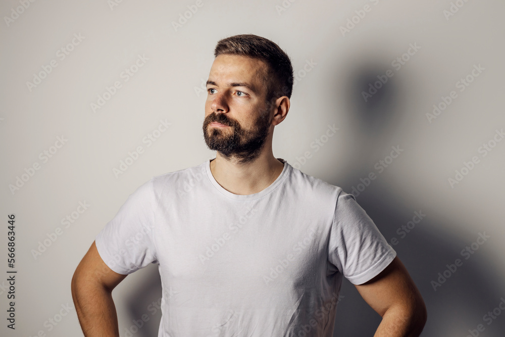 Portrait of a bearded man posing against the wall. Portrait of a bearded man posing against the wall.