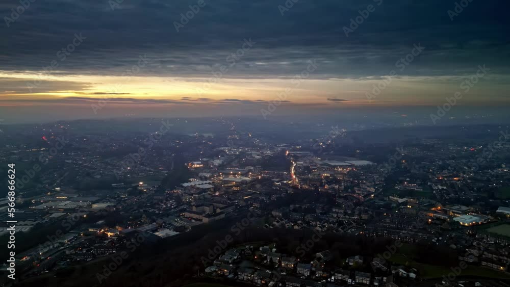 Aerial Drone Skyline Of a busy City Town At Sunset. Cars, roads, and misty sunset Aerial Drone Skyline Of a busy City Town At Sunset. Cars, roads, and misty sunset