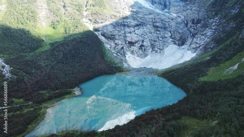 Boyabreen glacier and lake beneath it in Norway.  Zooming out drone footage photo