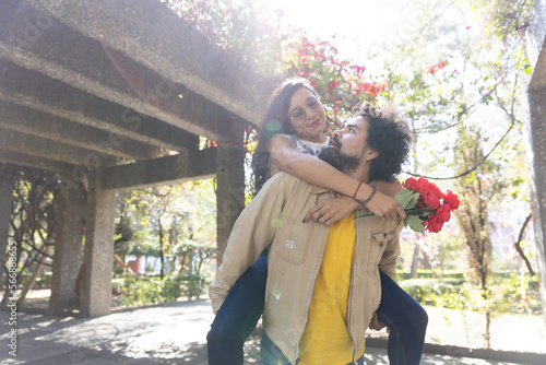 Mexican couple taking doing heart sign, valentine's day,